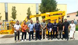 The Indonesian delegation with Platform Basket's RR14evo rail boom lift.