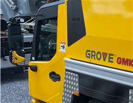 Manitowoc Grove GMK series AT crane in Grove yellow