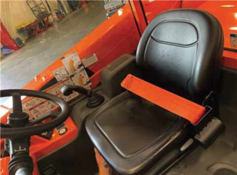 The orange seatbelt installed in a JLG telehandler