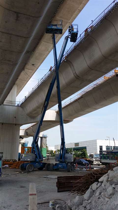 Genie booms work on the Singapore Mass Rapid Transit (MRT) extension.  