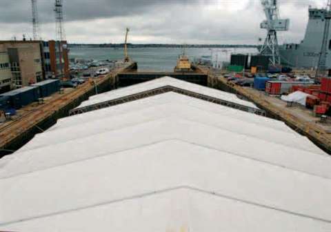The Haki 750 Roof covers the flight deck of HMS Portland in dry dock at Portsmouth.