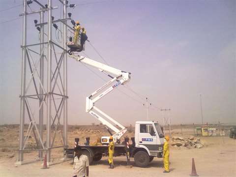 Oil &amp; Steel truck mount on Tata chassis working on repair of power transmission tower.