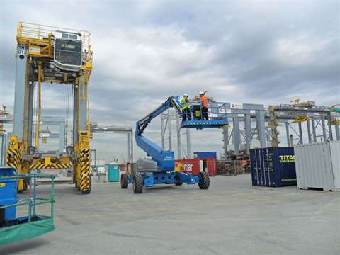 Genie ZX-135 at London Gateway with straddle sprinter carrier and gantry crane in background. 